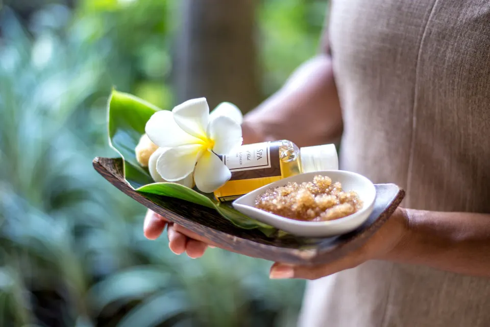 Spa treatment tray with flower, oil, and scrub at Coral Reef Club.