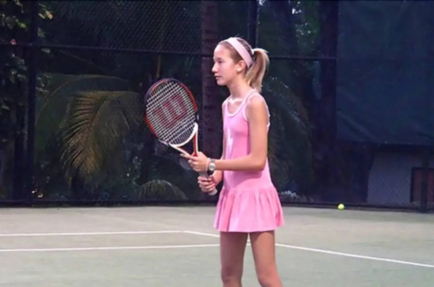 Young tennis player on a court at Coral Reef Club.