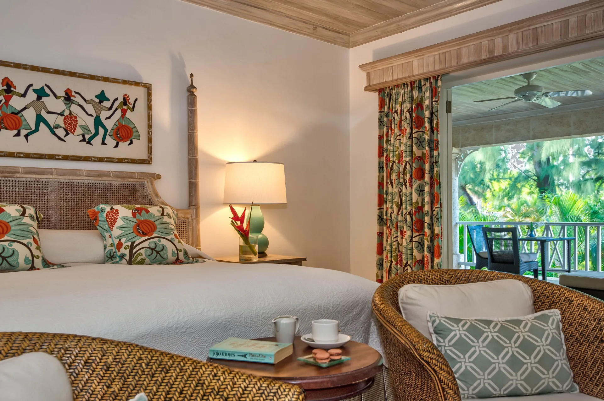 Cottage guest room with king bed and garden-facing balcony at Coral Reef Club.