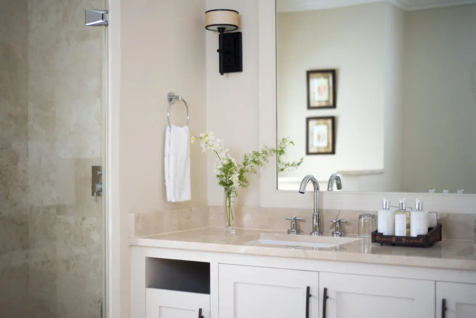 Junior Suite bathroom vanity and glass shower at Coral Reef Club.