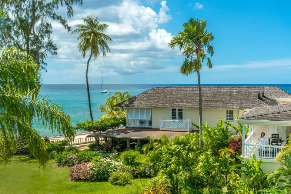 Junior Suite exterior among gardens by the sea at Coral Reef Club.