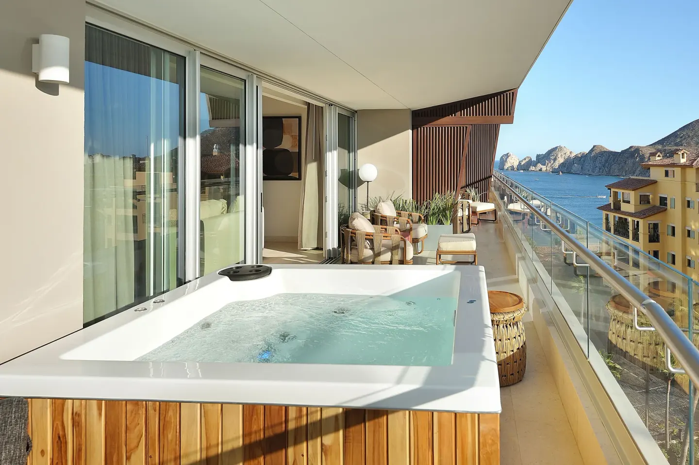 Guest balcony with hot tub and ocean view at Corazón Cabo.