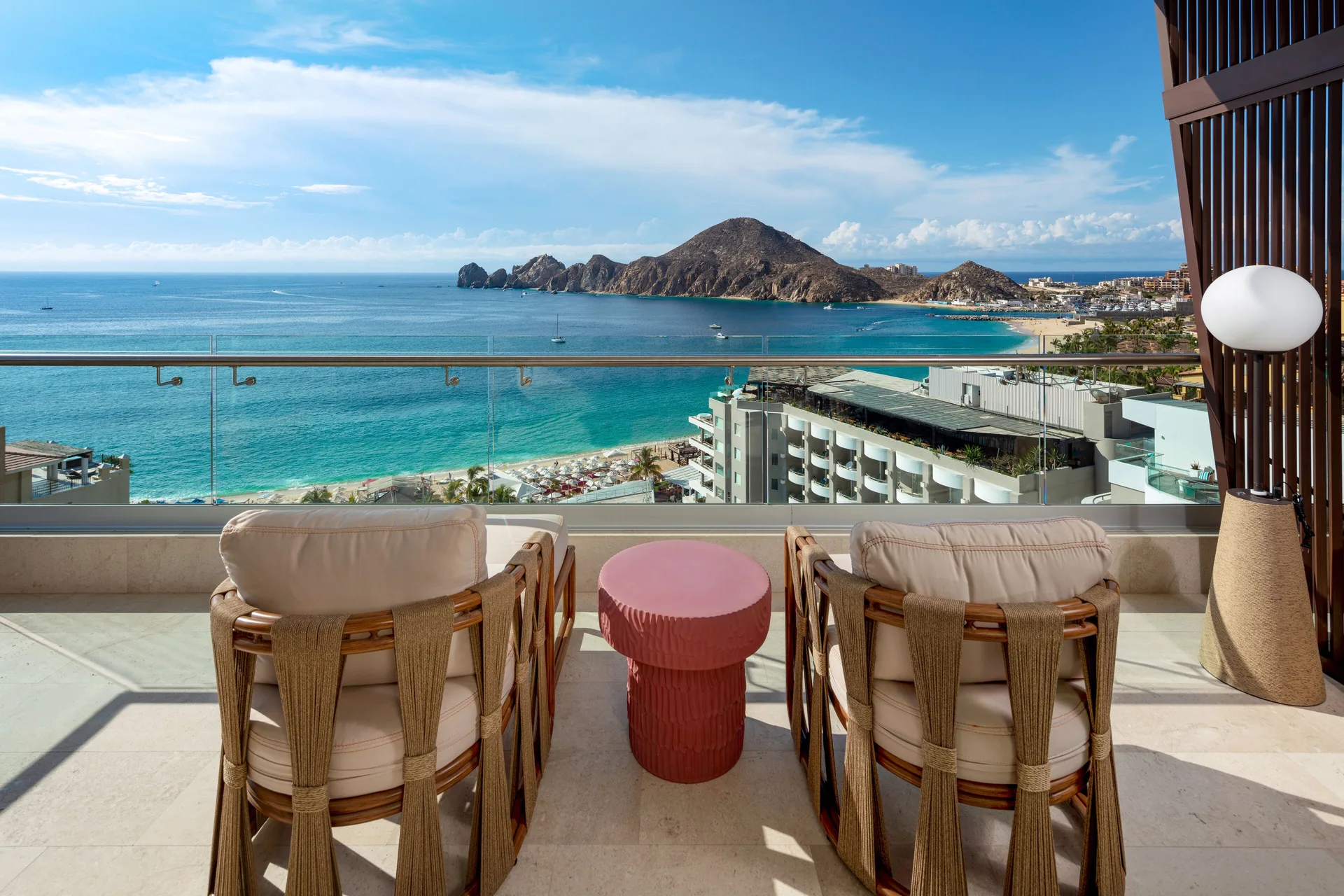 Infinity Ocean View balcony seating and bay panorama at Corazón Cabo.