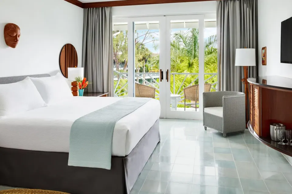 Deluxe Garden king bed room with balcony seating at Couples Negril.