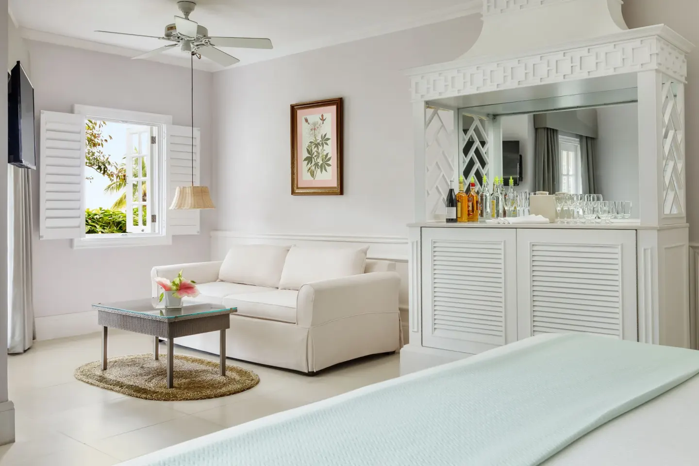 Beach Front Suite sitting area and refreshment cabinet at Couples Sans Souci.