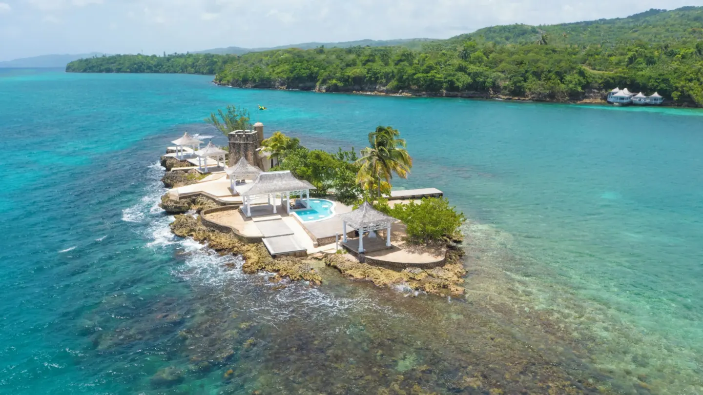 Aerial view of the private island and turquoise water at Couples Tower Isle.