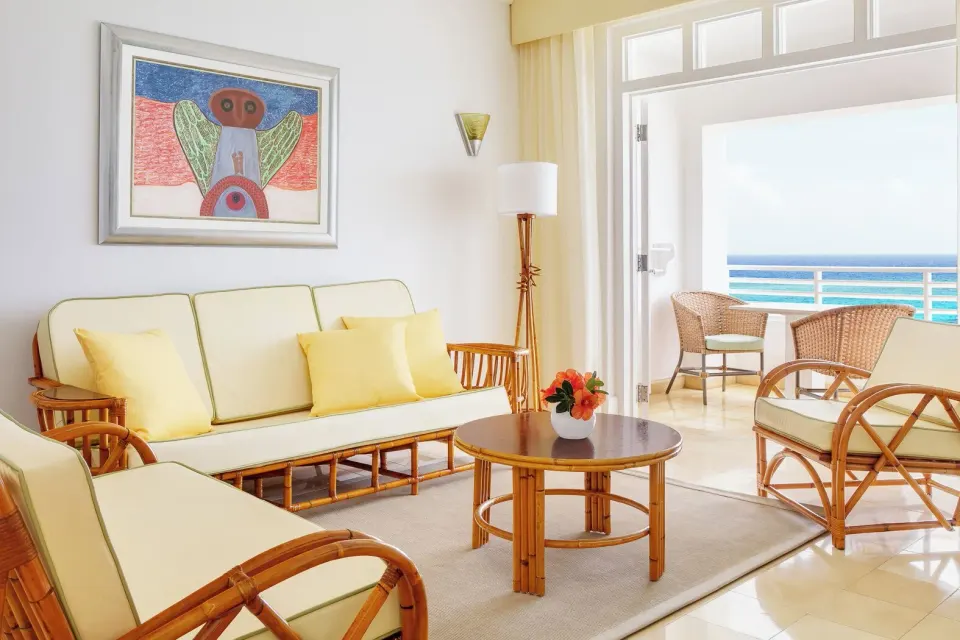 One Bedroom Ocean Suite sitting area with balcony ocean view at Couples Tower Isle.
