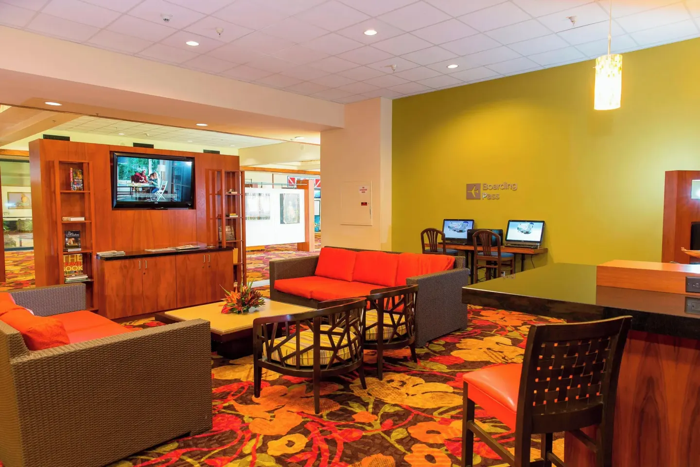 Lobby lounge seating and computer stations at Courtyard King Kamehameha's Kona Beach Hotel.