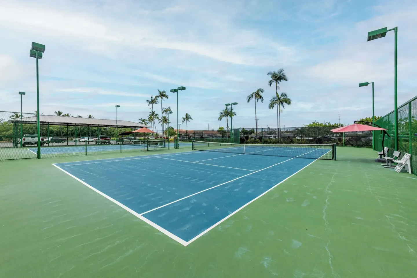Outdoor tennis courts at Courtyard King Kamehameha's Kona Beach Hotel.