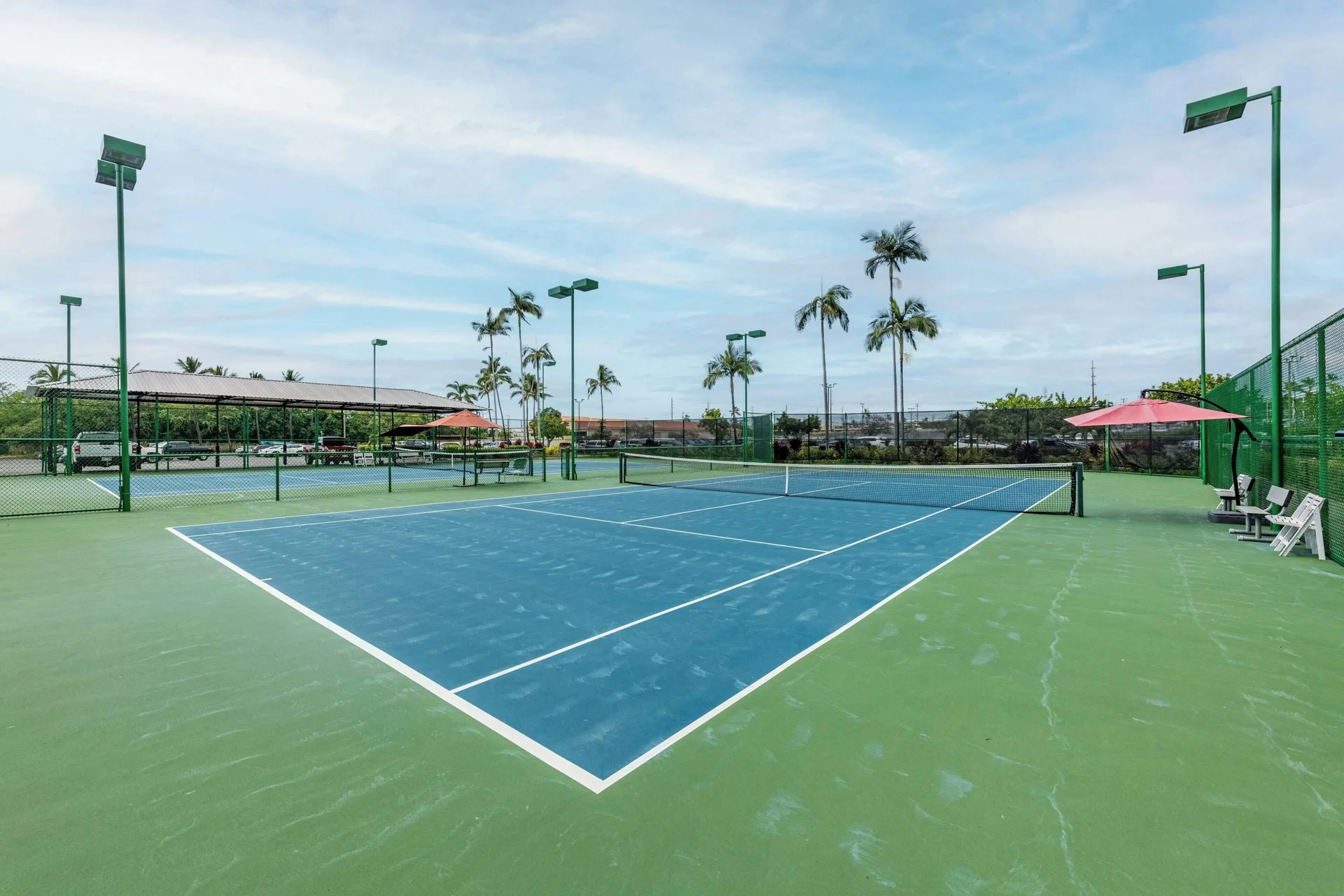 Outdoor tennis courts at Courtyard King Kamehameha's Kona Beach Hotel.