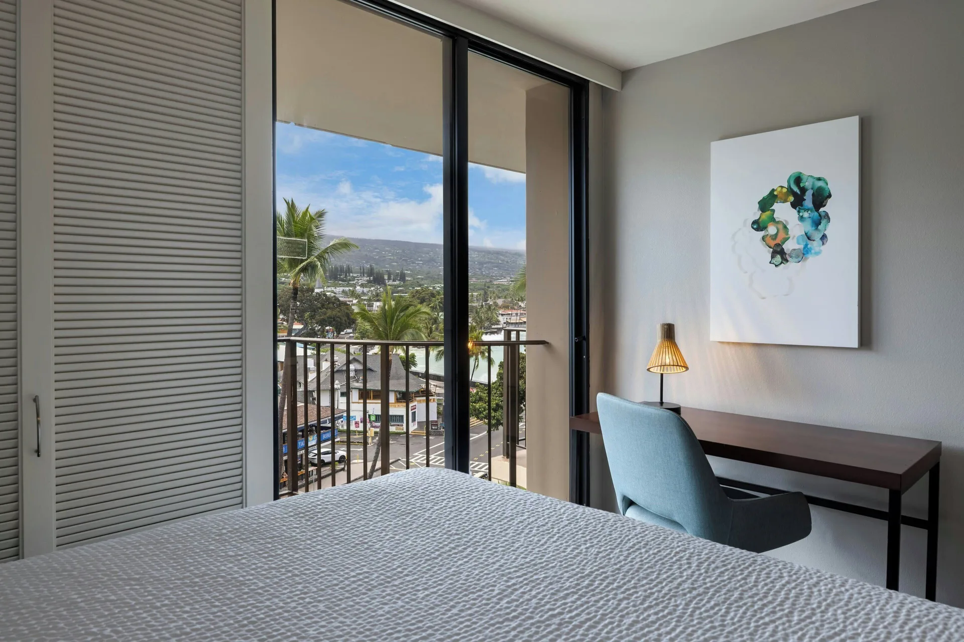 King guest room with balcony mountain view at Courtyard King Kamehameha's Kona Beach Hotel.