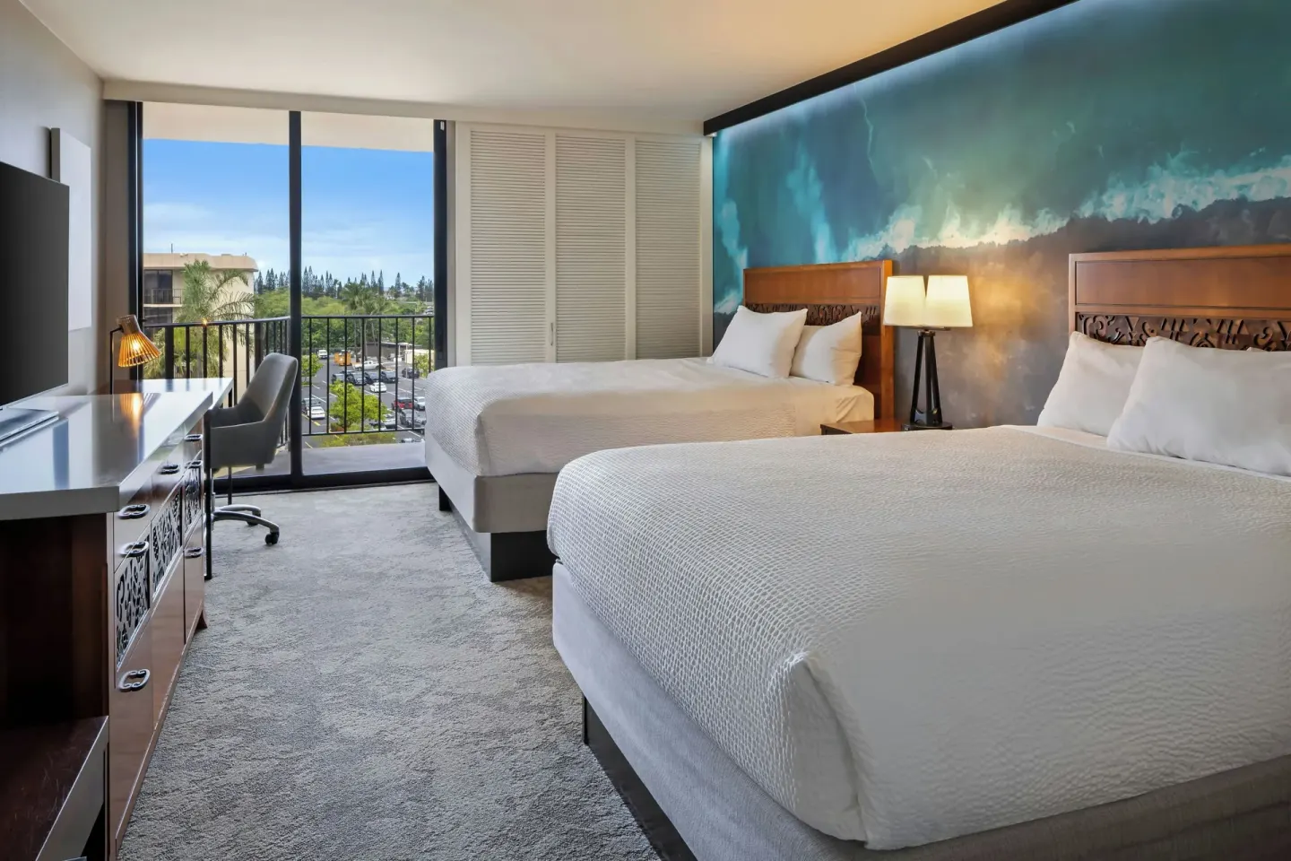 Two-bed resort view room with balcony at Courtyard King Kamehameha's Kona Beach Hotel.