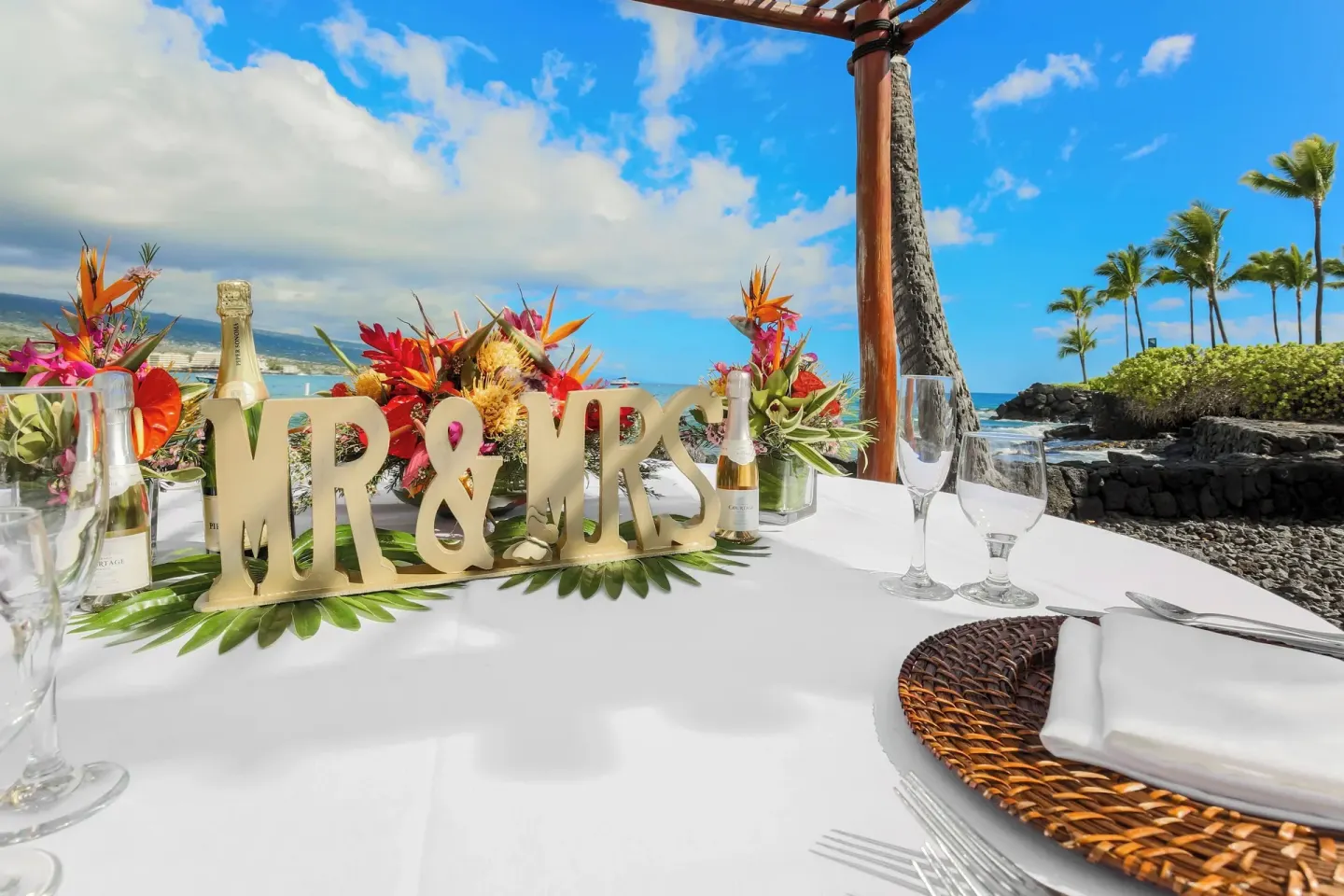 Mr and Mrs wedding table decor by the shoreline at Courtyard King Kamehameha's Kona Beach Hotel.