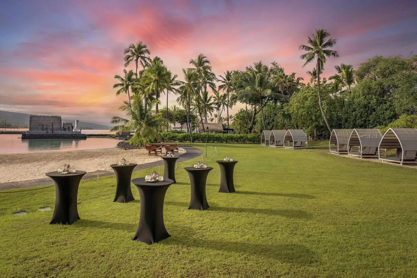 Sunset lawn reception setup beside the beach at Courtyard King Kamehameha's Kona Beach Hotel.