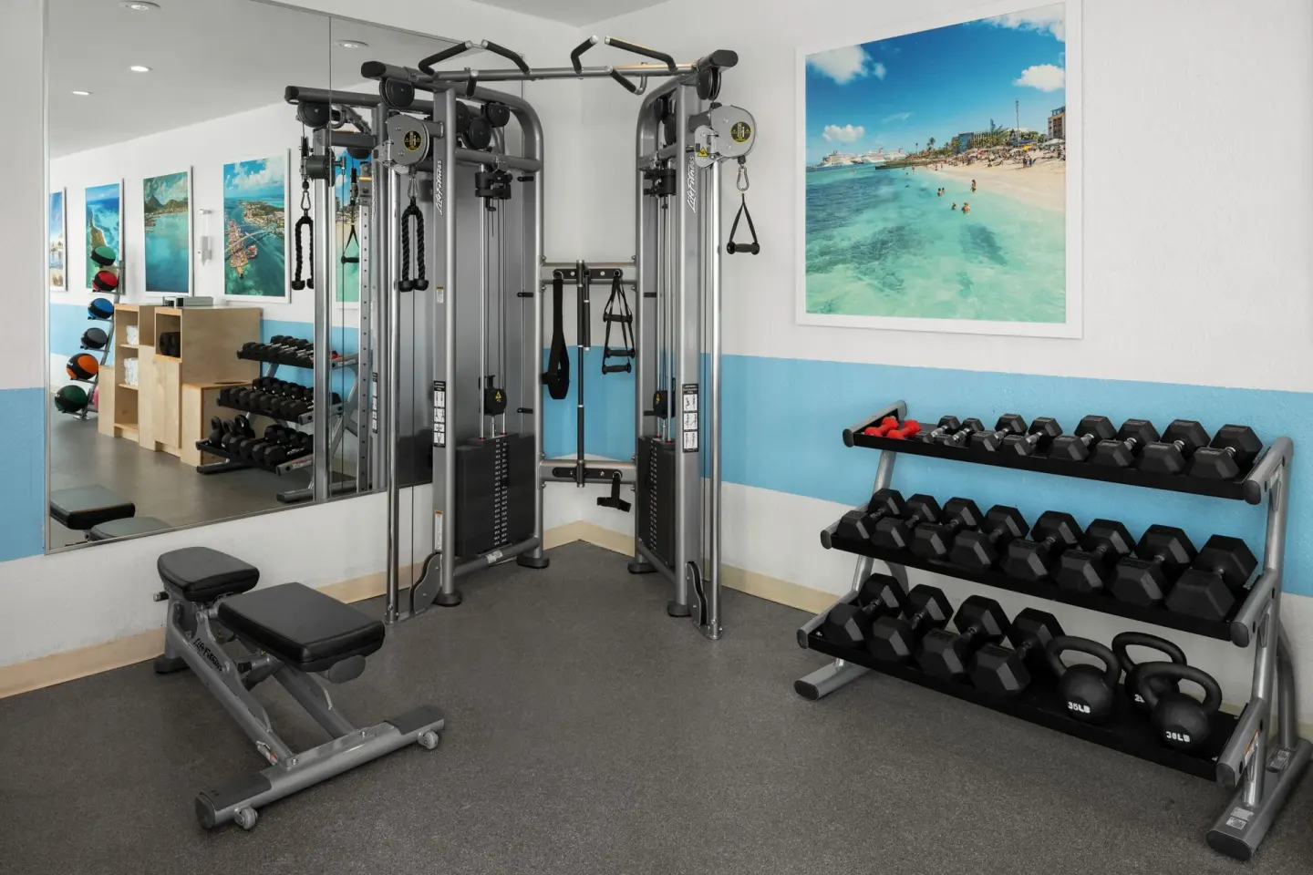 Fitness center weights and cable machine at Courtyard Nassau Downtown/Junkanoo Beach.