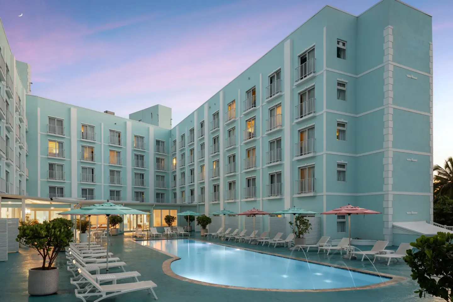 Pool courtyard at dusk at Courtyard Nassau Downtown/Junkanoo Beach.