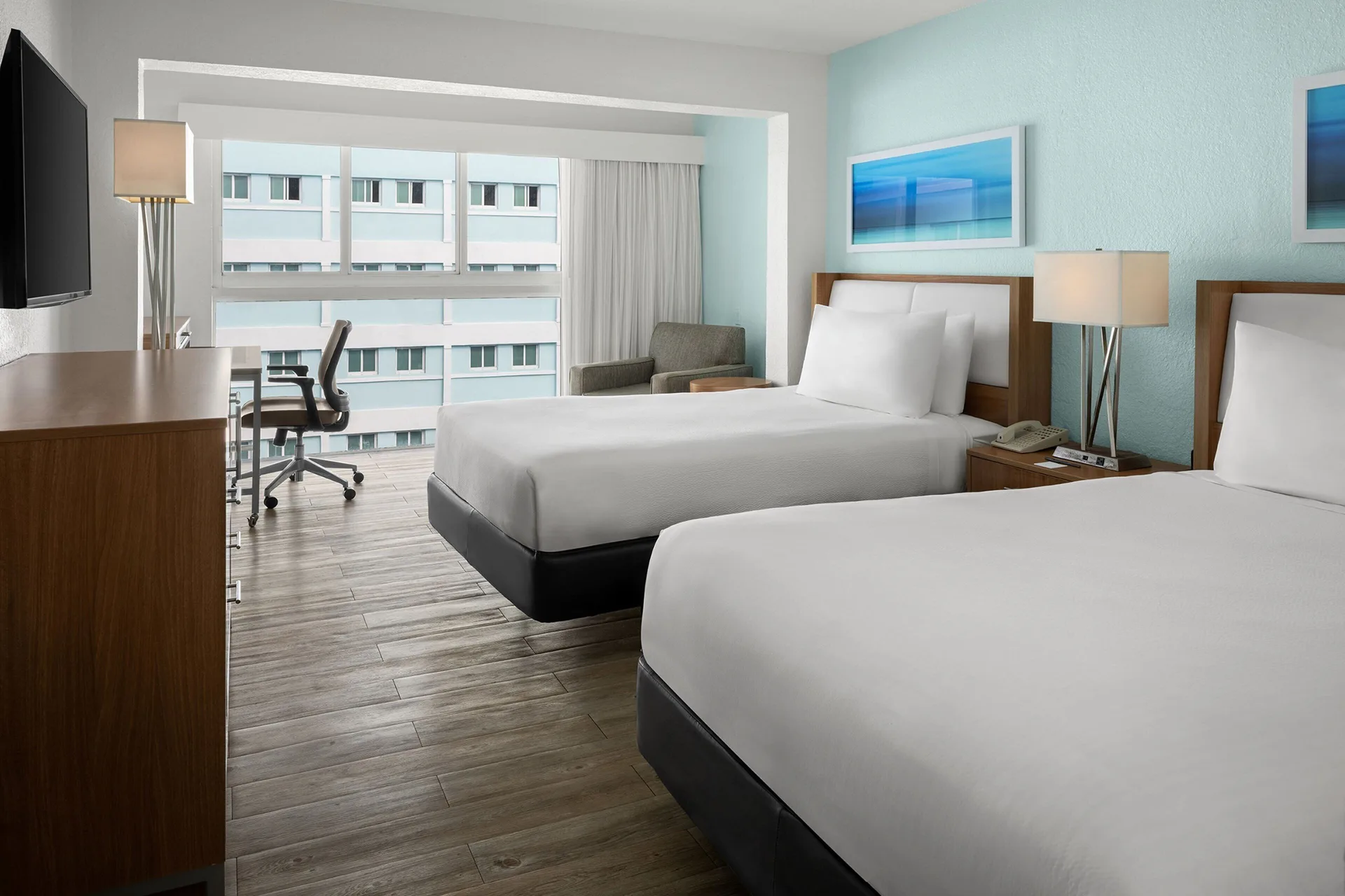 Standard room with two beds and window seating at Courtyard Nassau Downtown/Junkanoo Beach.