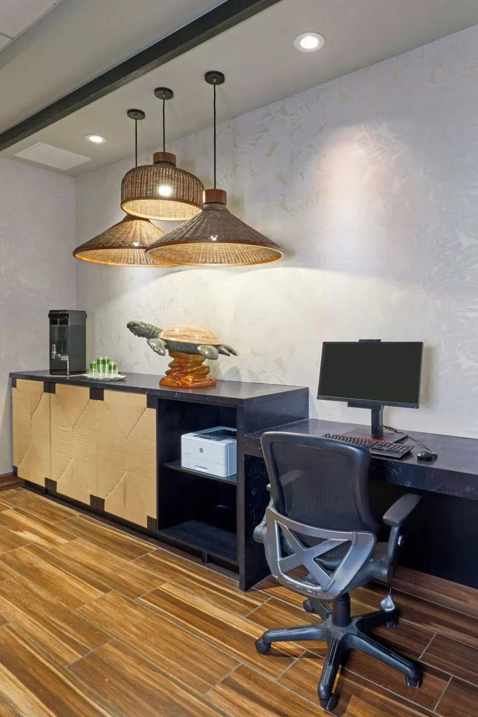 Business center desk with computer, printer, and coffee station at Courtyard Oahu North Shore.