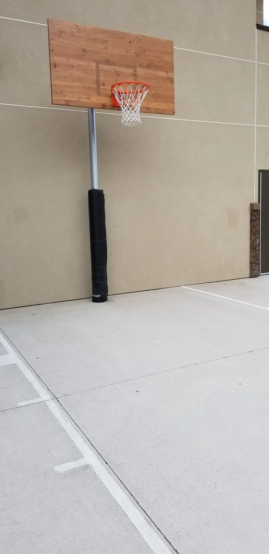 Basketball hoop on an outdoor court at Courtyard Oahu North Shore.