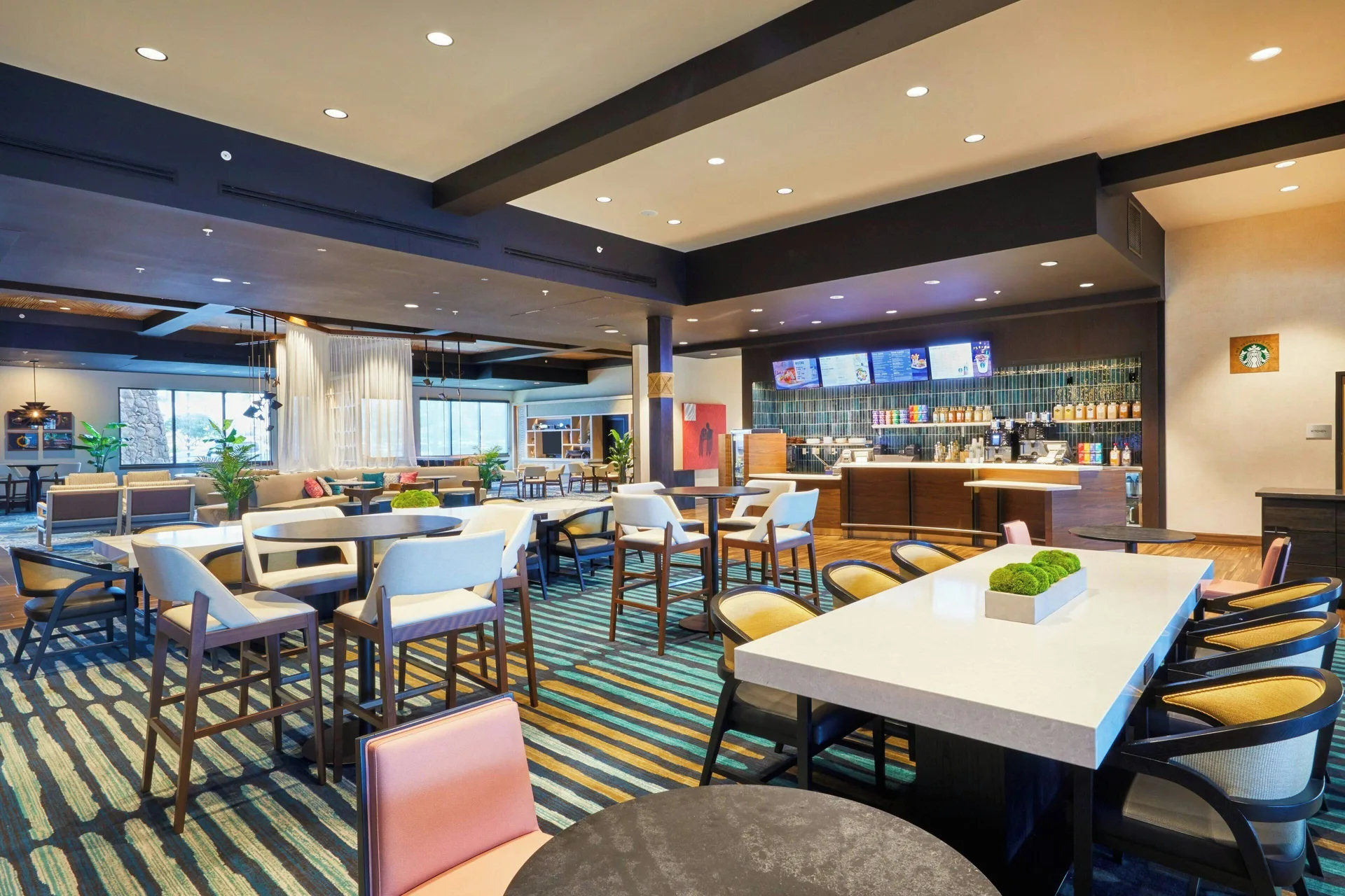 Open dining and lounge area with service counter at Courtyard Oahu North Shore.