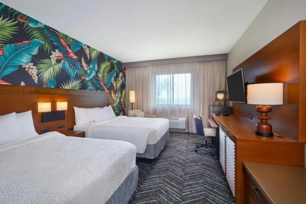 Mobility accessible hearing accessible room with two beds at Courtyard Oahu North Shore.
