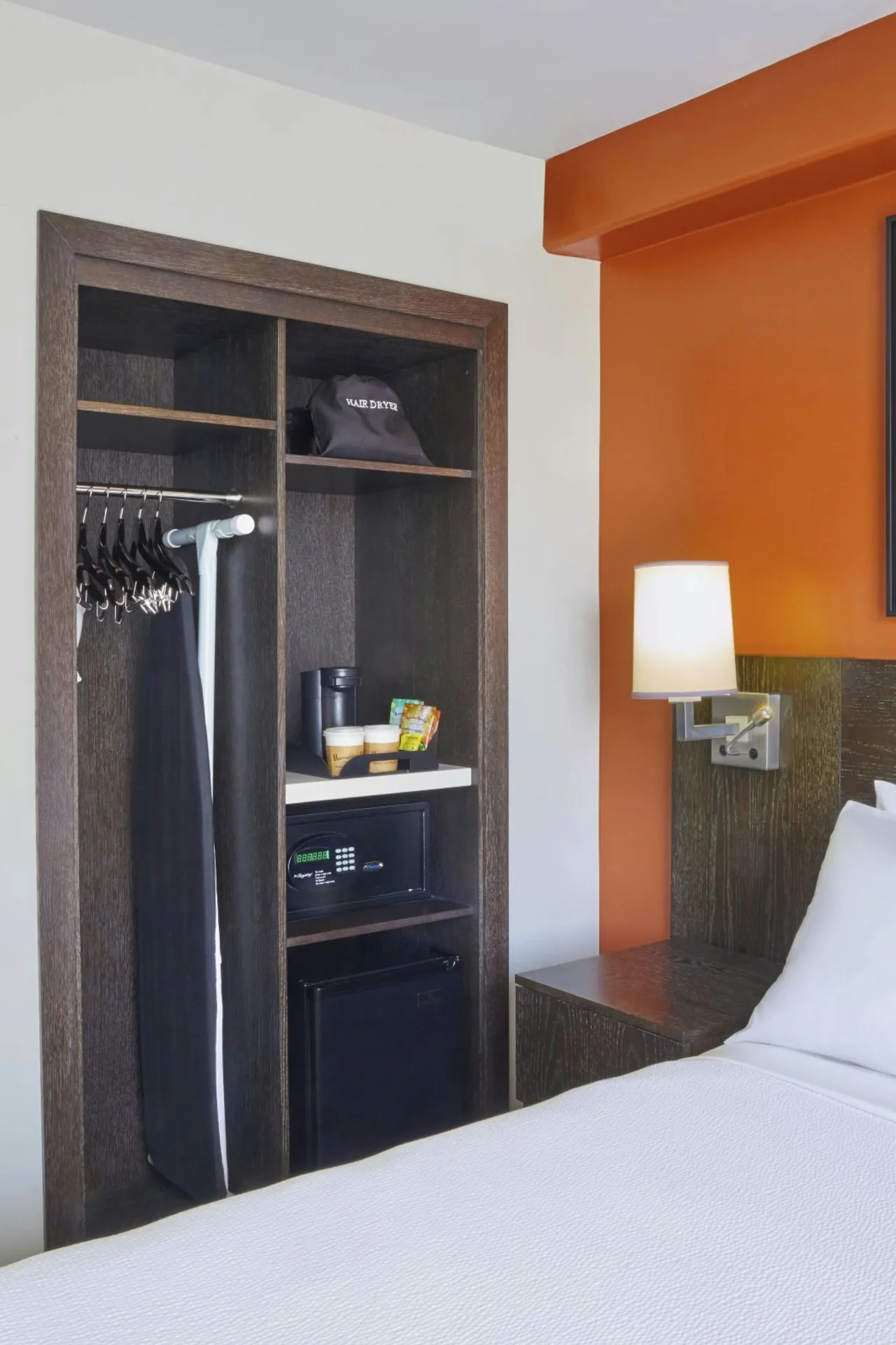 Standard Studio storage area beside the king bed at Courtyard Waikiki Beach.