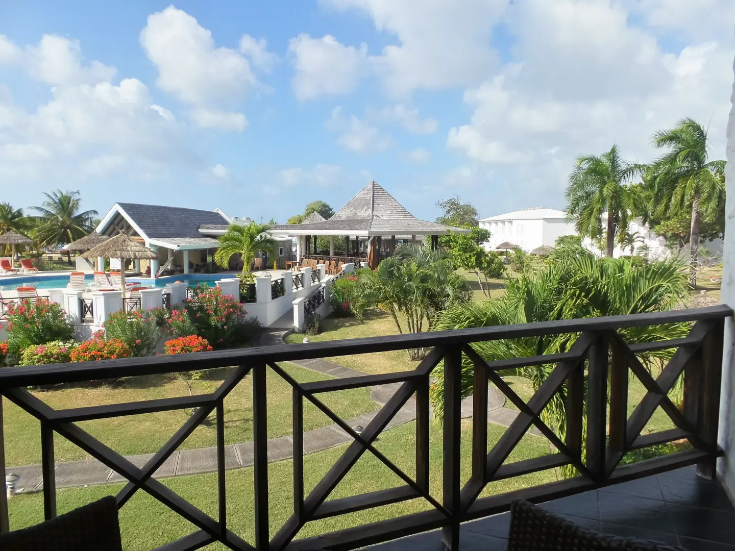 Balcony view over the pool area and gardens at Coyaba Beach Resort.