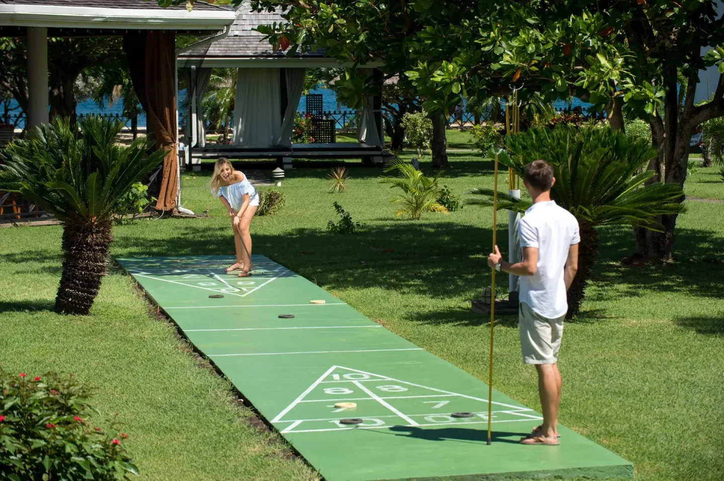Guests playing shuffleboard on the lawn at Coyaba Beach Resort.