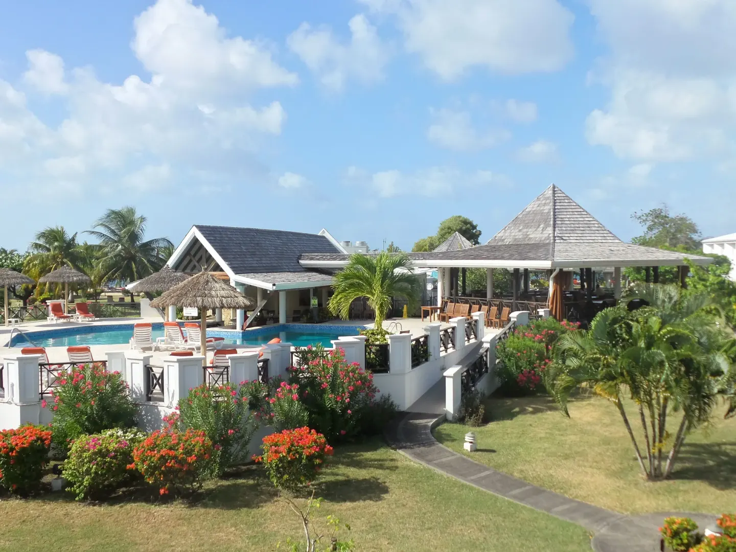 Pool terrace, gardens and open-air pavilion at Coyaba Beach Resort.