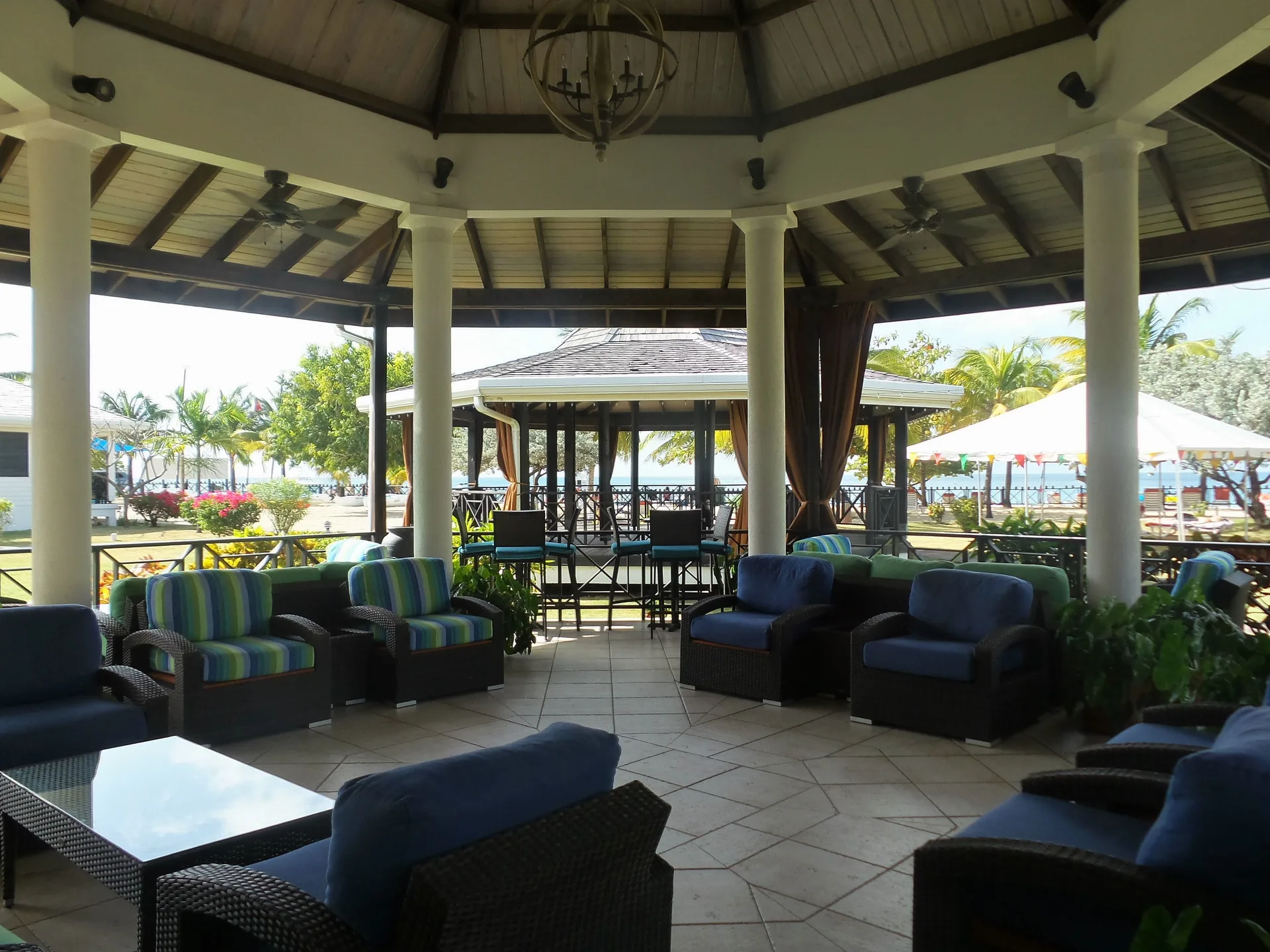 Shaded pavilion lounge facing the beach and sea at Coyaba Beach Resort.