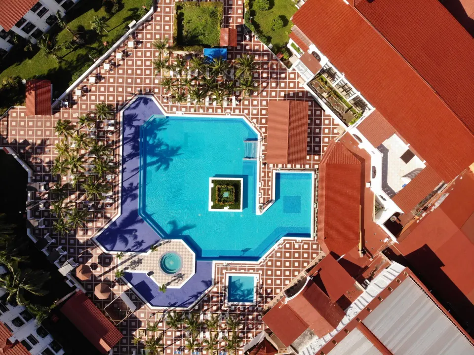 Aerial view of the resort's large central pool and surrounding deck at Cozumel Hotel & Resort