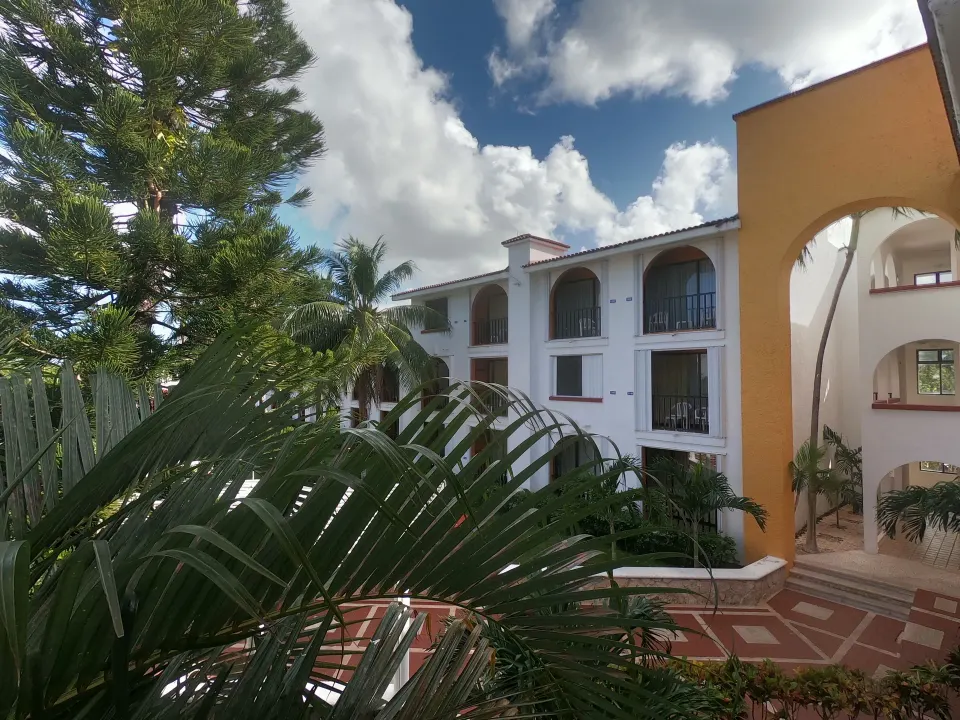 Exterior view of resort buildings and tropical landscaping at Cozumel Hotel & Resort.