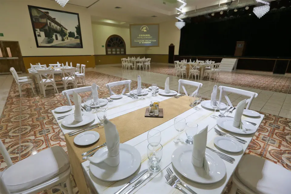 Banquet table set for dinner inside the resort ballroom at Cozumel Hotel & Resort