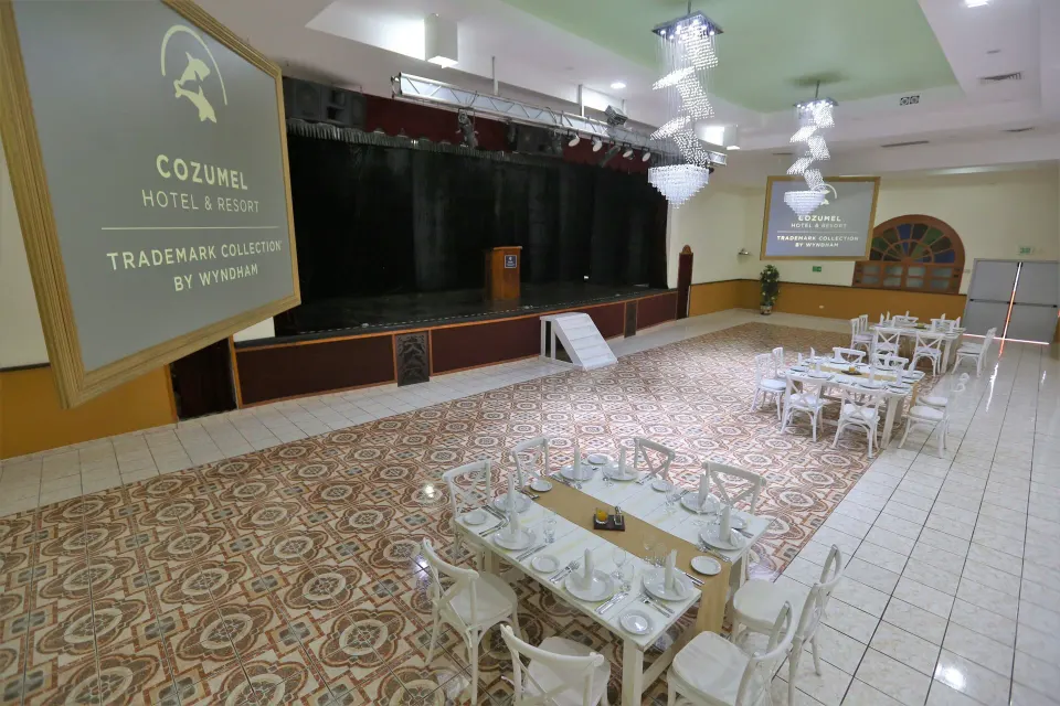 Stage and projection screens in event hall at Cozumel Hotel & Resort