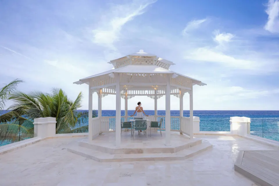 White seaside gazebo overlooking the ocean at Cozumel Palace.
