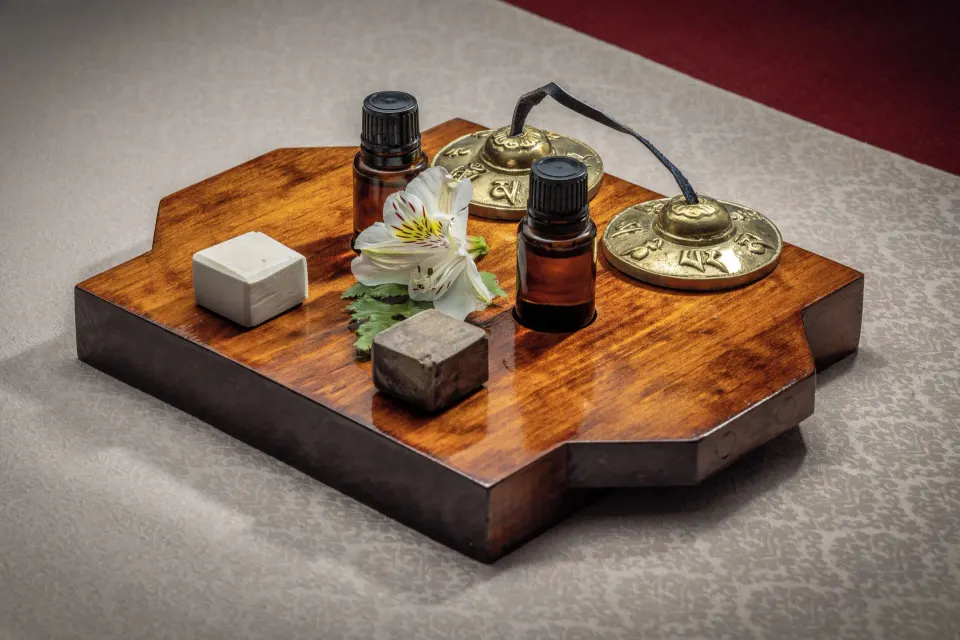 Wooden tray with essential oils and spa accessories at Cozumel Palace