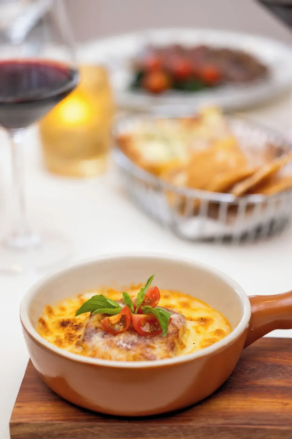 Baked gratin dish with cherry tomatoes and basil at Cozumel Palace