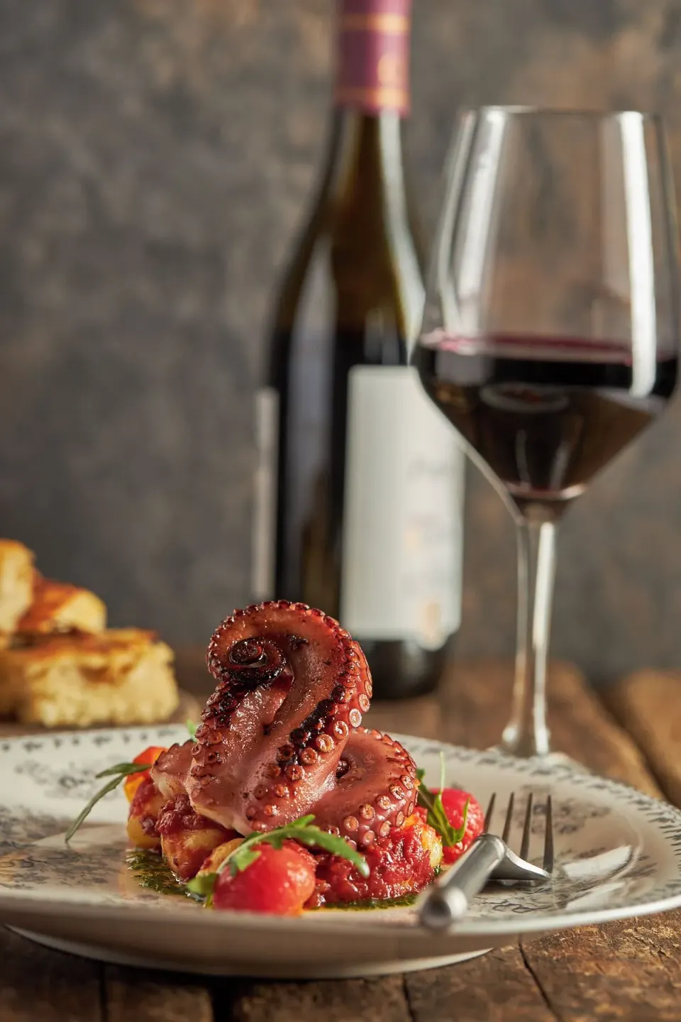 Plated octopus with wine at Cozumel Palace dining