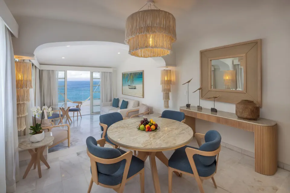 Dining and living area of a Superior Two Bedroom Presidential Suite with ocean view at Cozumel Palace