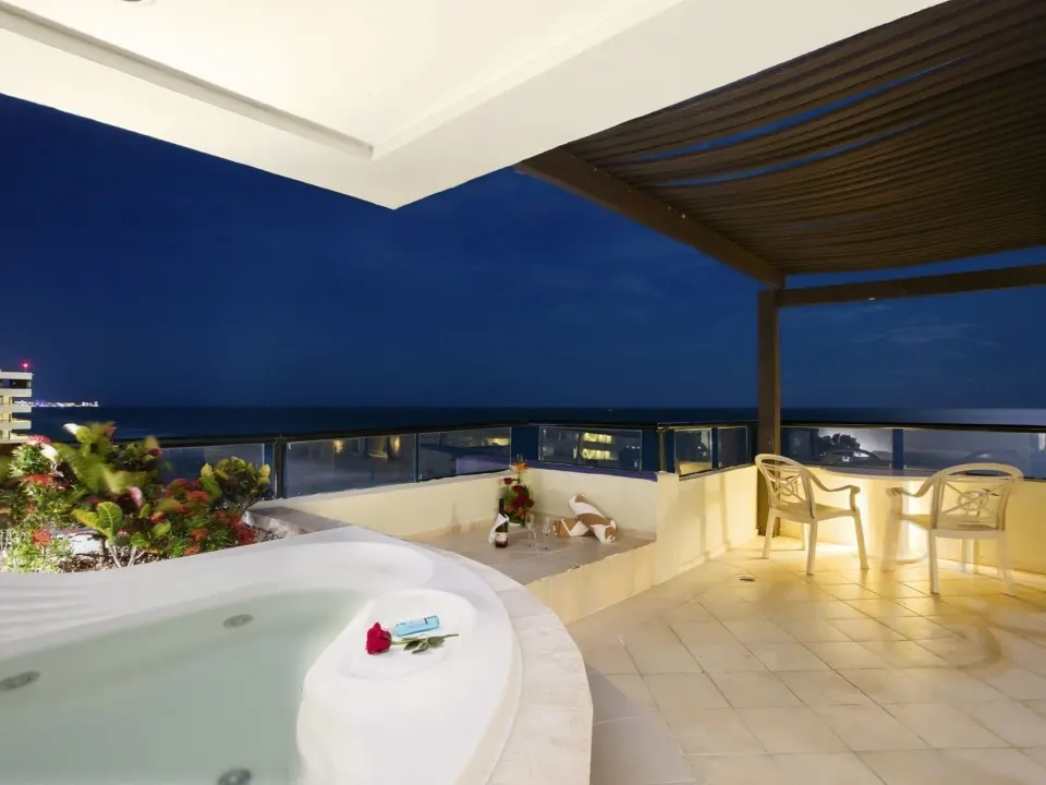 Honeymoon Room terrace with whirlpool tub and ocean view at Crown Paradise Club Cancun.