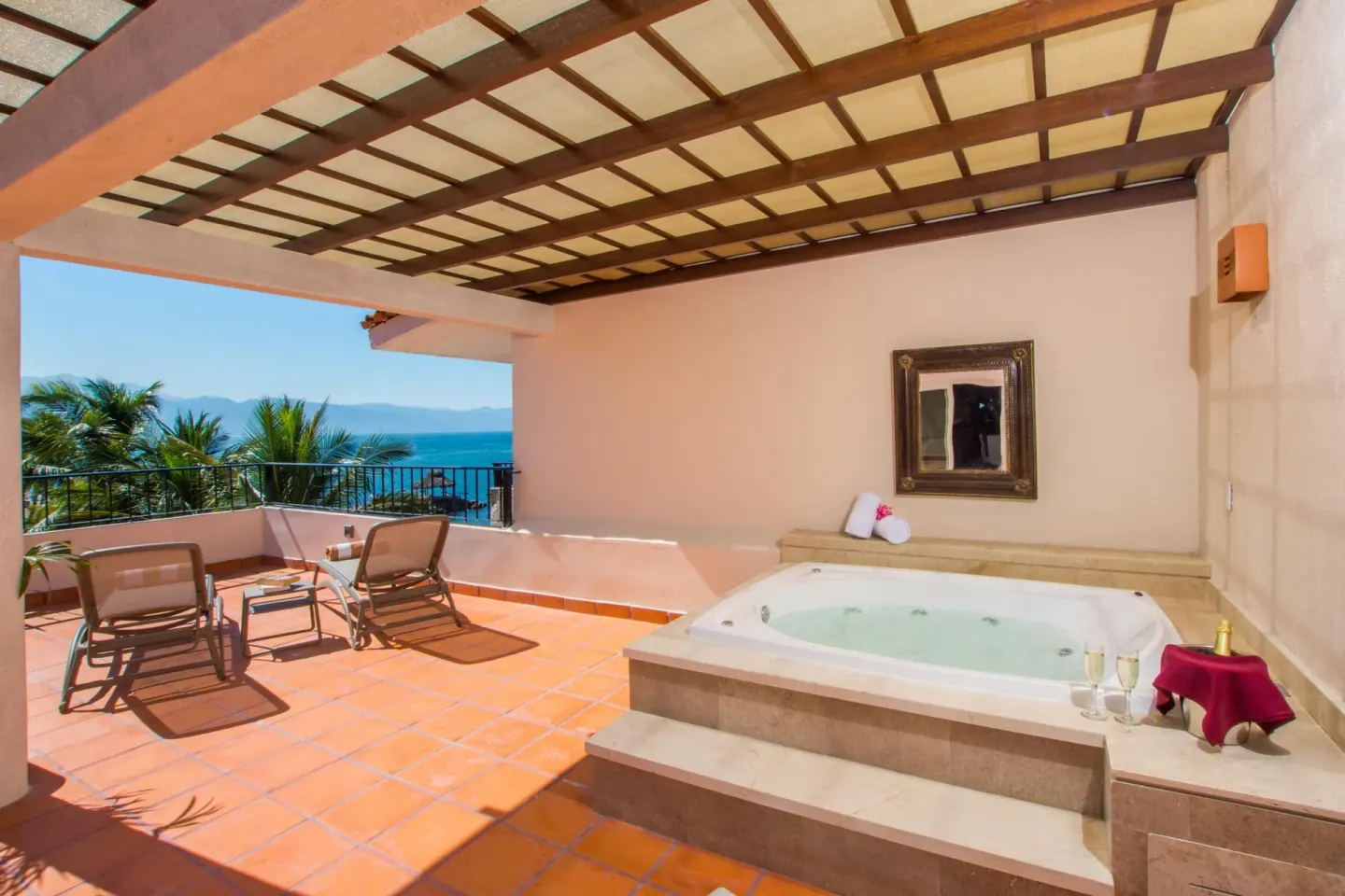 Ocean-view terrace with whirlpool tub at Crown Paradise Club Puerto Vallarta.