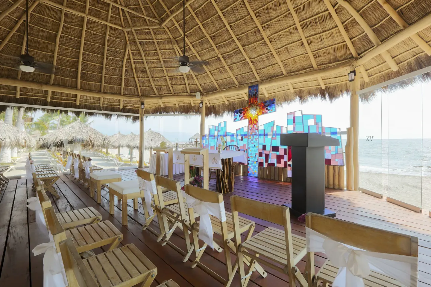 Beachfront chapel setup with altar and chairs at Crown Paradise Club Puerto Vallarta.