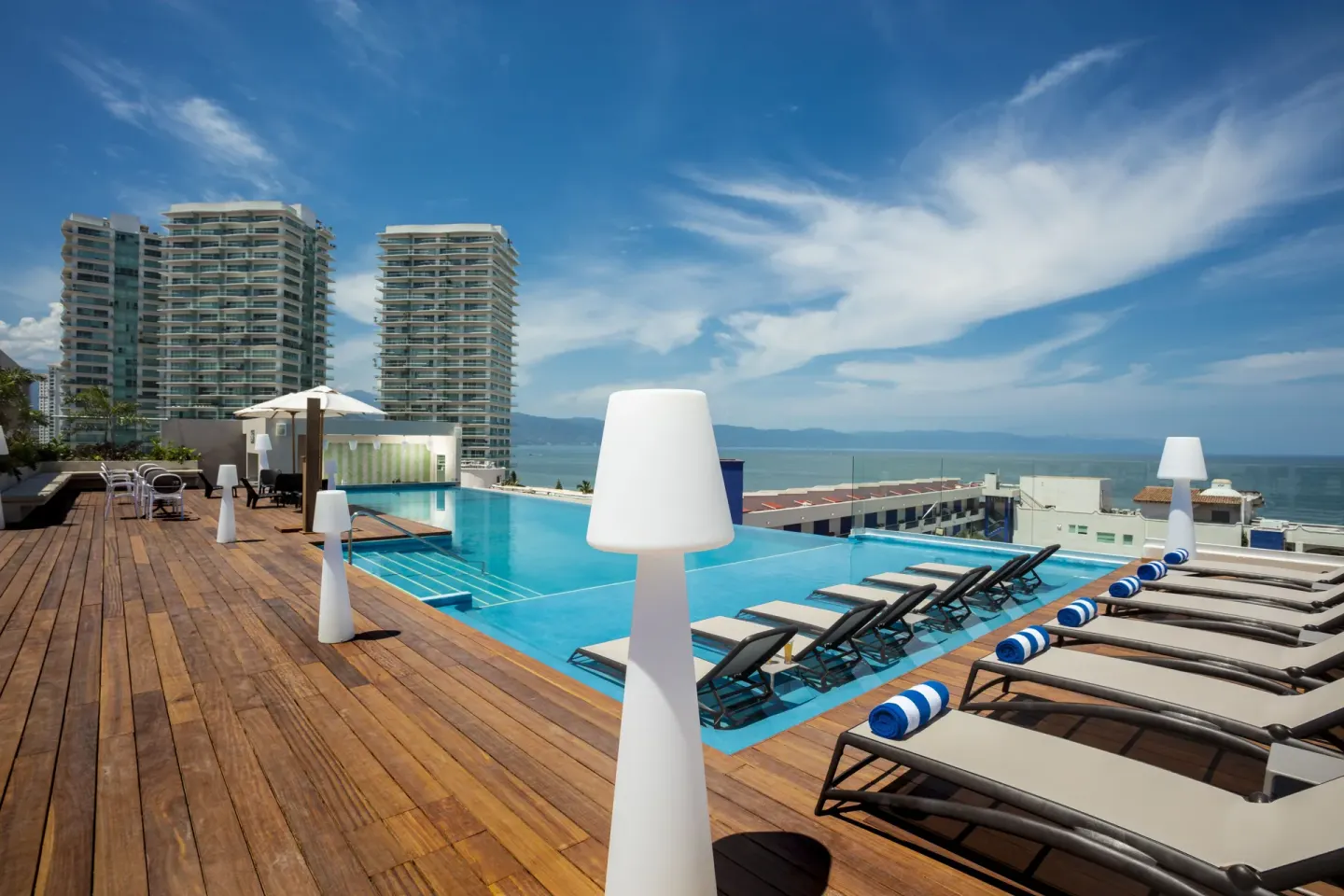 Rooftop infinity pool and loungers at Crown Paradise Golden Resort.