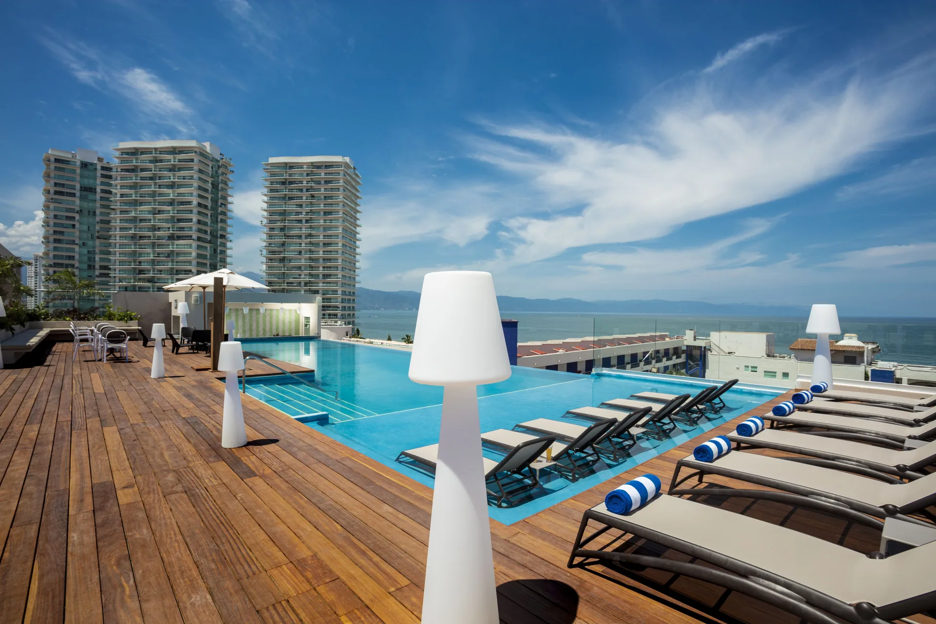 Rooftop infinity pool and loungers at Crown Paradise Golden Resort.