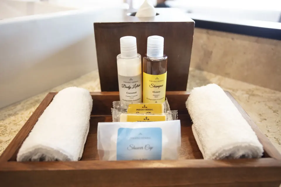 Deluxe Room bath amenities and rolled towels at Crown Paradise Golden Resort.