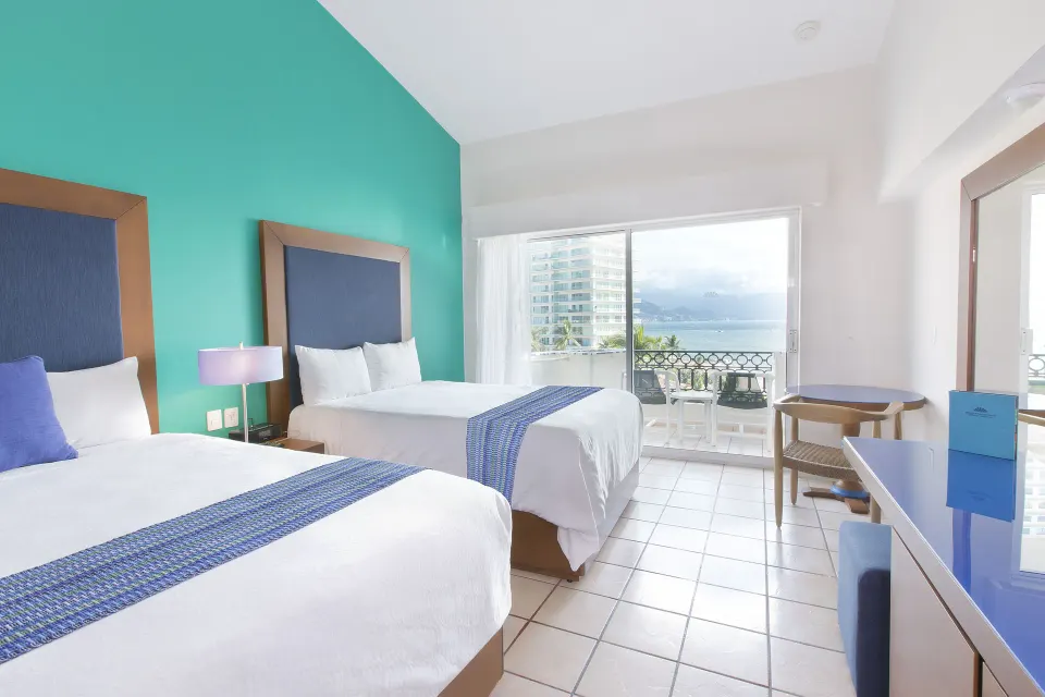 Deluxe Room with two beds and balcony view at Crown Paradise Golden Resort.