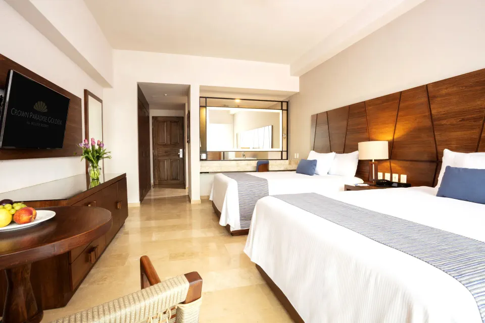Deluxe Room with two beds and vanity area at Crown Paradise Golden Resort.