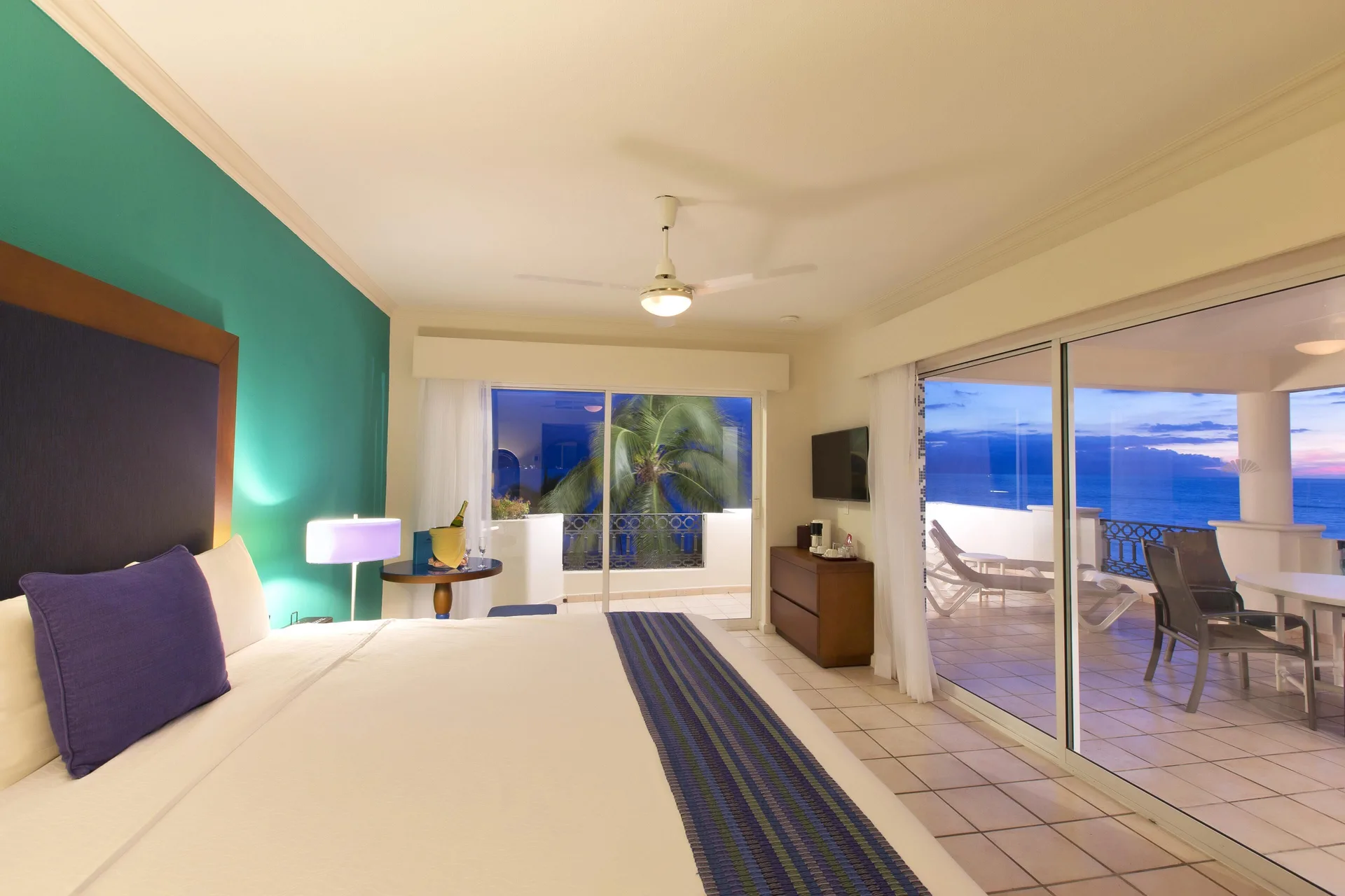 Honeymoon Room sea view king bed and oceanfront terrace at Crown Paradise Golden Resort.