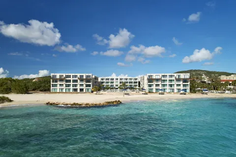 Beachfront resort buildings and turquoise water at Curacao Marriott Beach Resort.