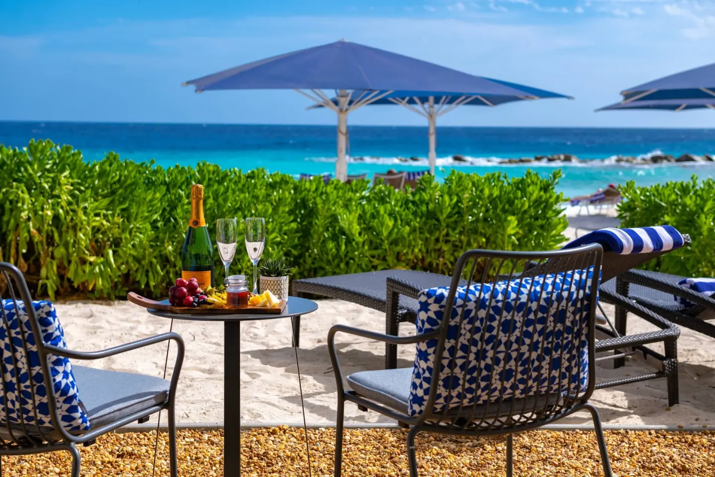 Beachfront seating with drinks and fruit at Curacao Marriott Beach Resort.